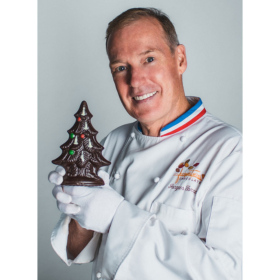 Chef Jacques Torres holding small dark Chocolate Christmas Tree